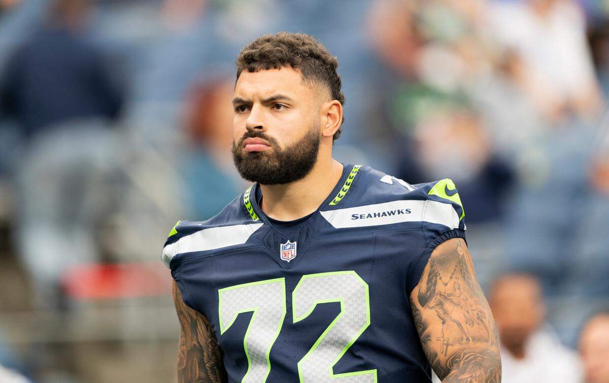 Seattle Seahawks offensive tackle Abraham Lucas (72) looks on from the sidelines before the preseason game against the Cleveland Browns at Lumen Field, on Saturday, Aug. 24, 2024 in Seattle, Wash.