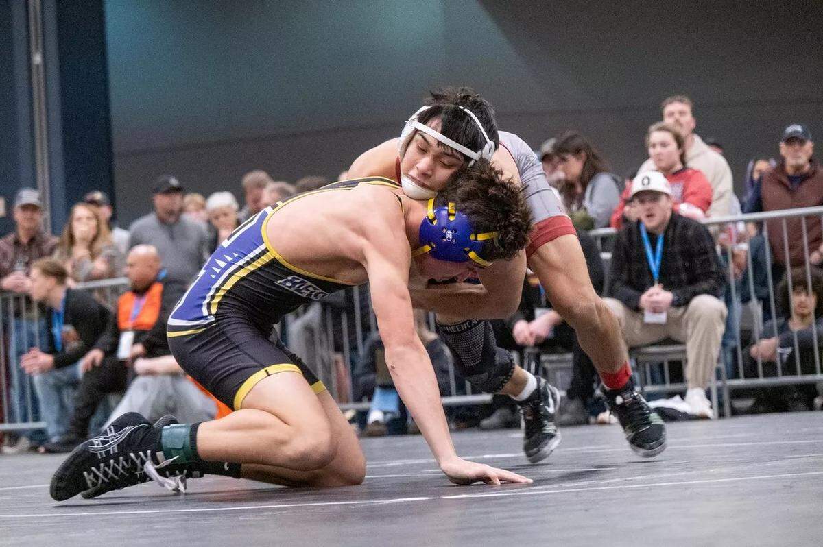University (Spokane) wrestler Czar Quintanilla, top, wrestles at the Class 4A District 6 boys wrestling tournament on Feb. 7, 2026 at the Spokane Convention Center.