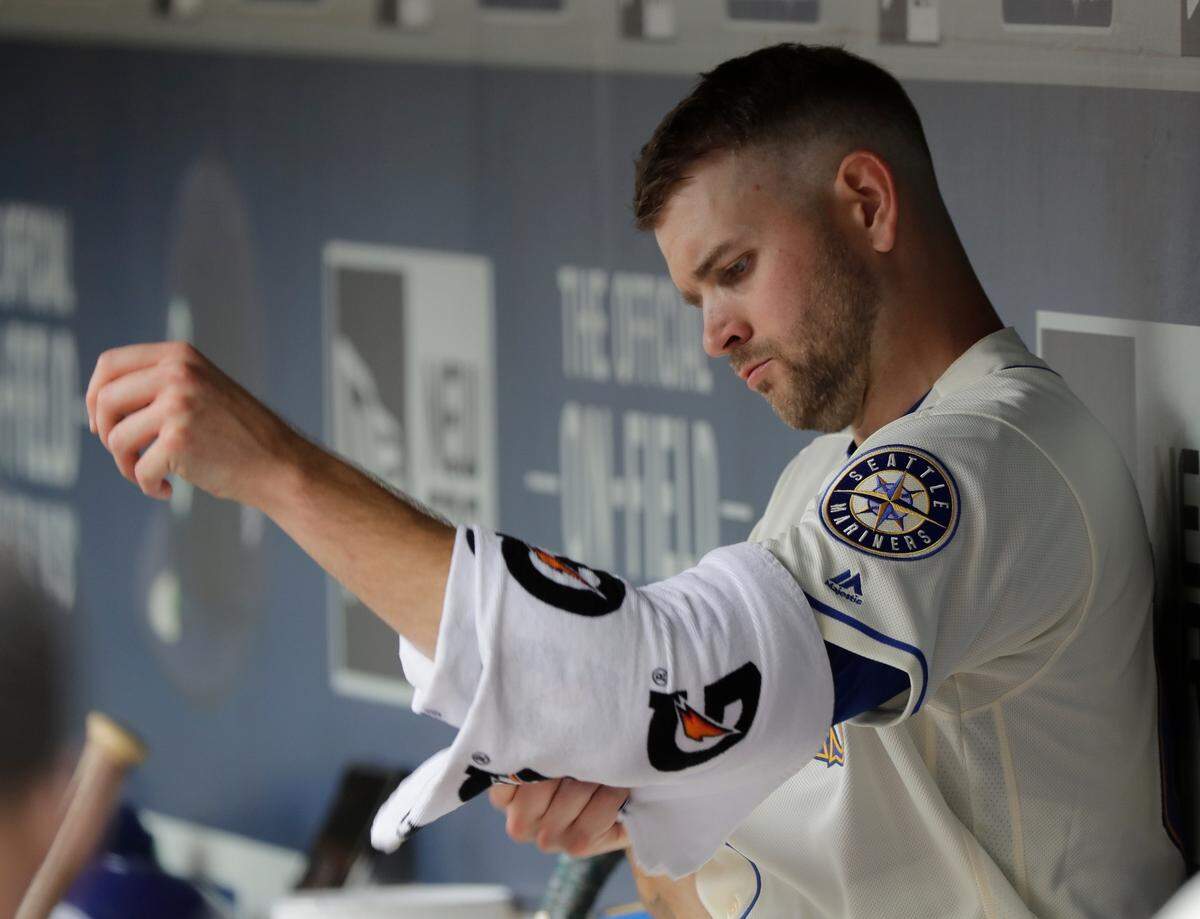 Seattle Mariners starting pitcher James Paxton wraps his arm as he sits in the dugout during a baseball game against the Kansas City Royals, Sunday, July 1, 2018, in Seattle. (AP Photo/Ted S. Warren)