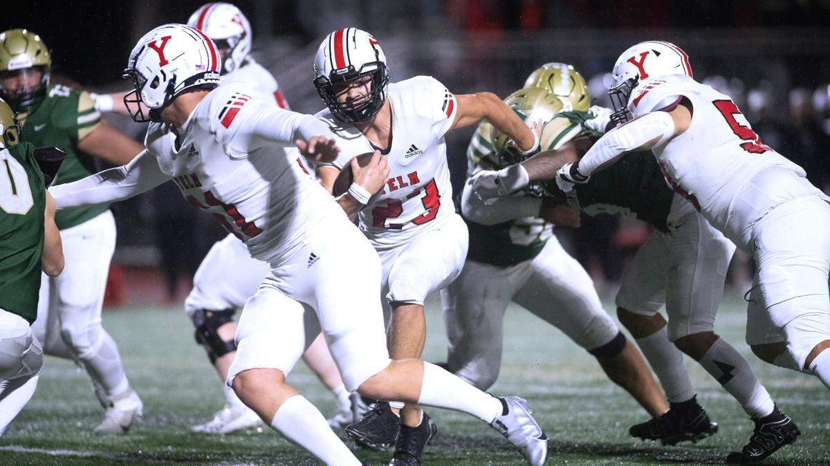 Yelm running back Brayden Platt follows blocker Chris Haas for a three-yard touchdown run during Friday night’s 3A SSC football game against the Timberline Blazers at South Sound Stadium in Lacey, Washington, on Oct. 13, 2023. Yelm won the game, 54-7.