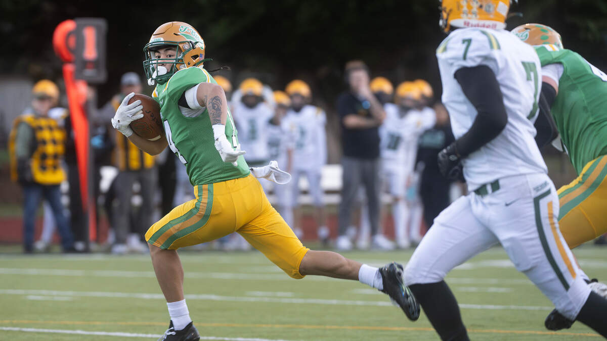 Tumwater wide receiver Sunny Nguyen breaks loose in front of Sehome defensive back Andre Watson (7) for a touchdown reception during Satuday afternoon’s state playoff game at Tumwater District Stadium in Tumwater, Washington, on Friday, Nov. 23, 2024. Tumwater won the game, 70-7, to advance to the state semifinals.