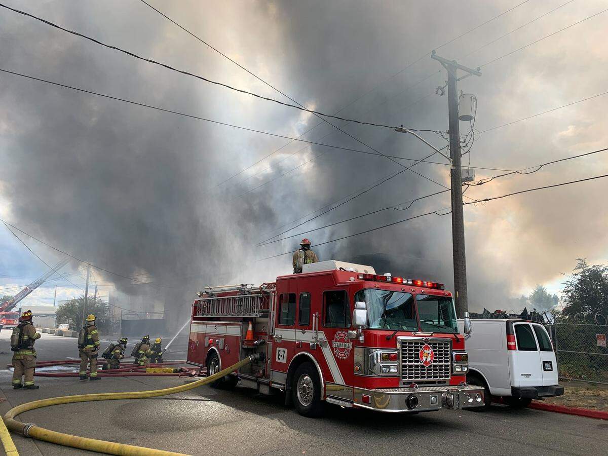 Fire crew in Tacoma battling a fire in a local South Tacoma auto shop on Wednesday, August 30, 2023.