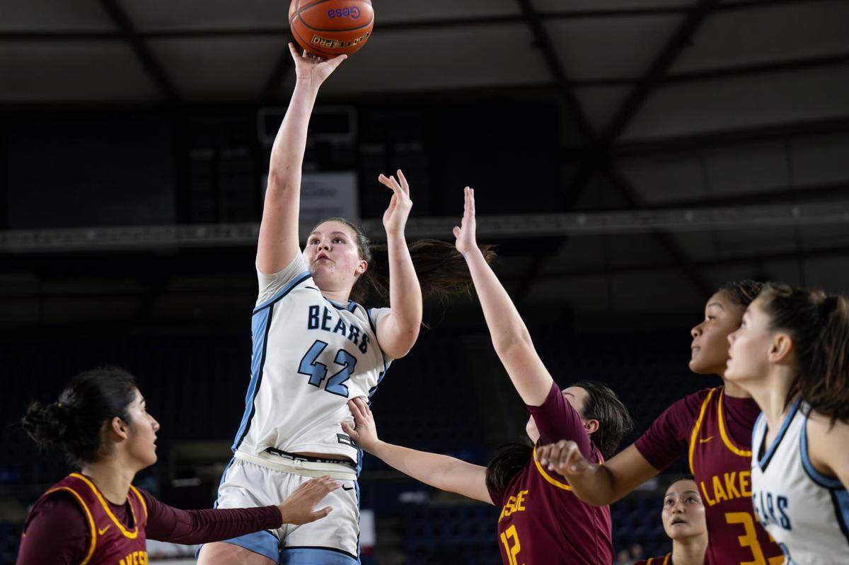 Central Valley forward Brynn McGaughy (42) attempts a shot as Lakeside point guard Helena Christofilis (12) defends during the fourth quarter of the Class 3A state championship game at the Tacoma Dome on Saturday, March 8, 2025, in Tacoma, Wash.