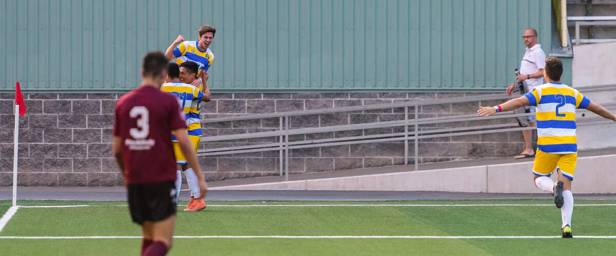 Peninsula High School 2018 grad Keeton Heggerness celebrating a goal which he scored in his debut game on June 20 for the Kitsap Pumas.