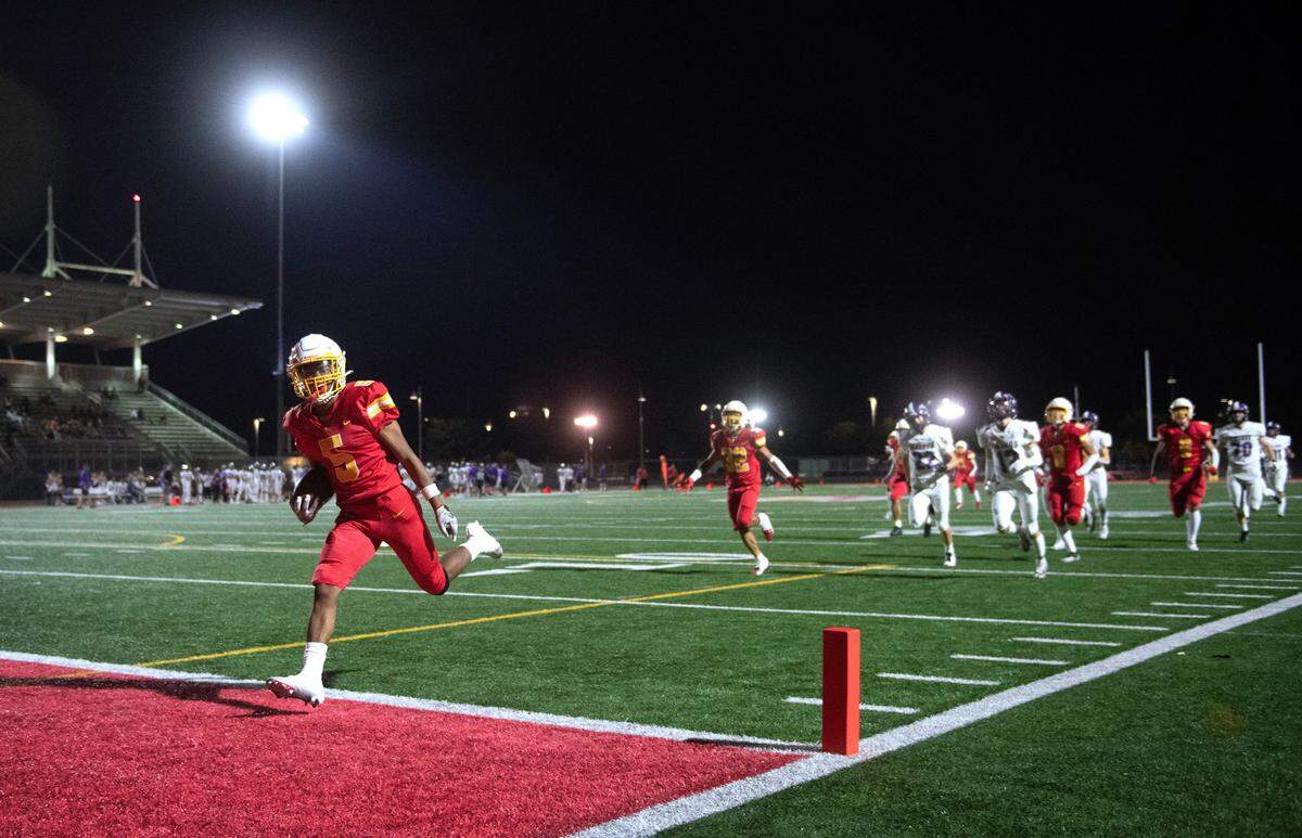 Mount Tahoma kick returner Deonjae Ervin streaks into the end zone for a kickoff return for a touchdown during Friday night’s season-opening football game against the North Kitsap Vikings at Mount Tahoma High School in Tacoma, Washington on Sept. 1, 2023. North Kitsap won the game, 24-21.