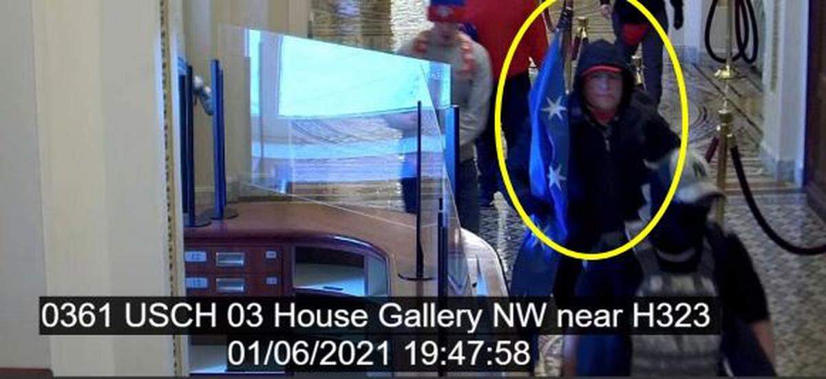 This screenshot from the complaint filed against David Charles Rhine in U.S. District Court shows a surveillance image from the U.S. Capitol Jan. 6, 2021.
