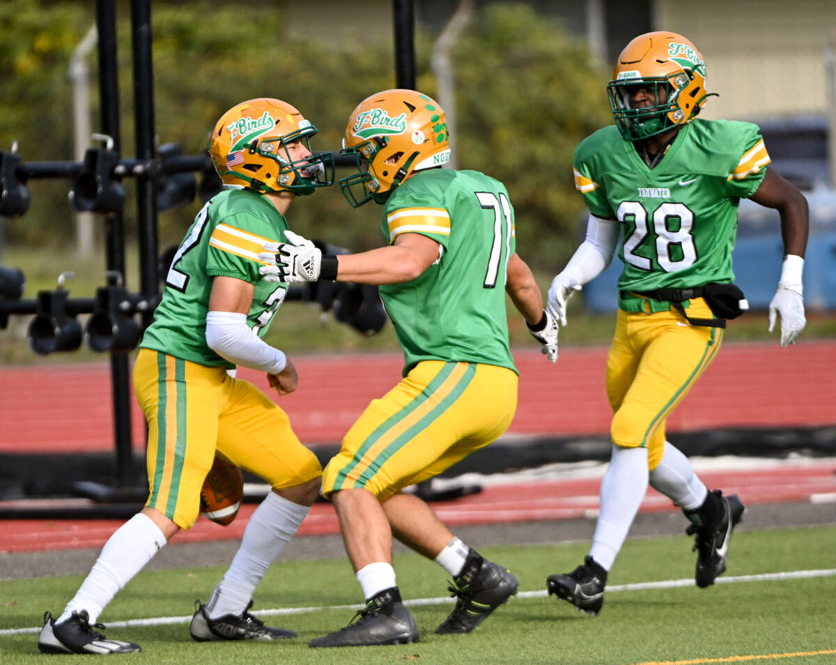Tumwater’s Peyton Davis (32) celebrates a touchdown with teammate during the first half of the 2A state quarterfinals against the Clarkston Bantams at Tumwater District Stadium, Saturday, Nov. 18, 2023, in Tumwater, Wash.