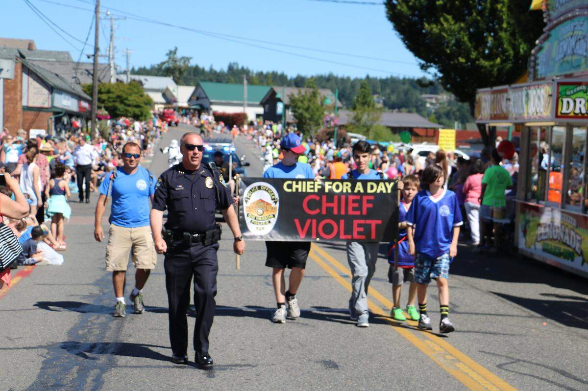 Gig Harbor Police Chief Kelly Busey walks in the 2016 Maritime Gig Parade.
