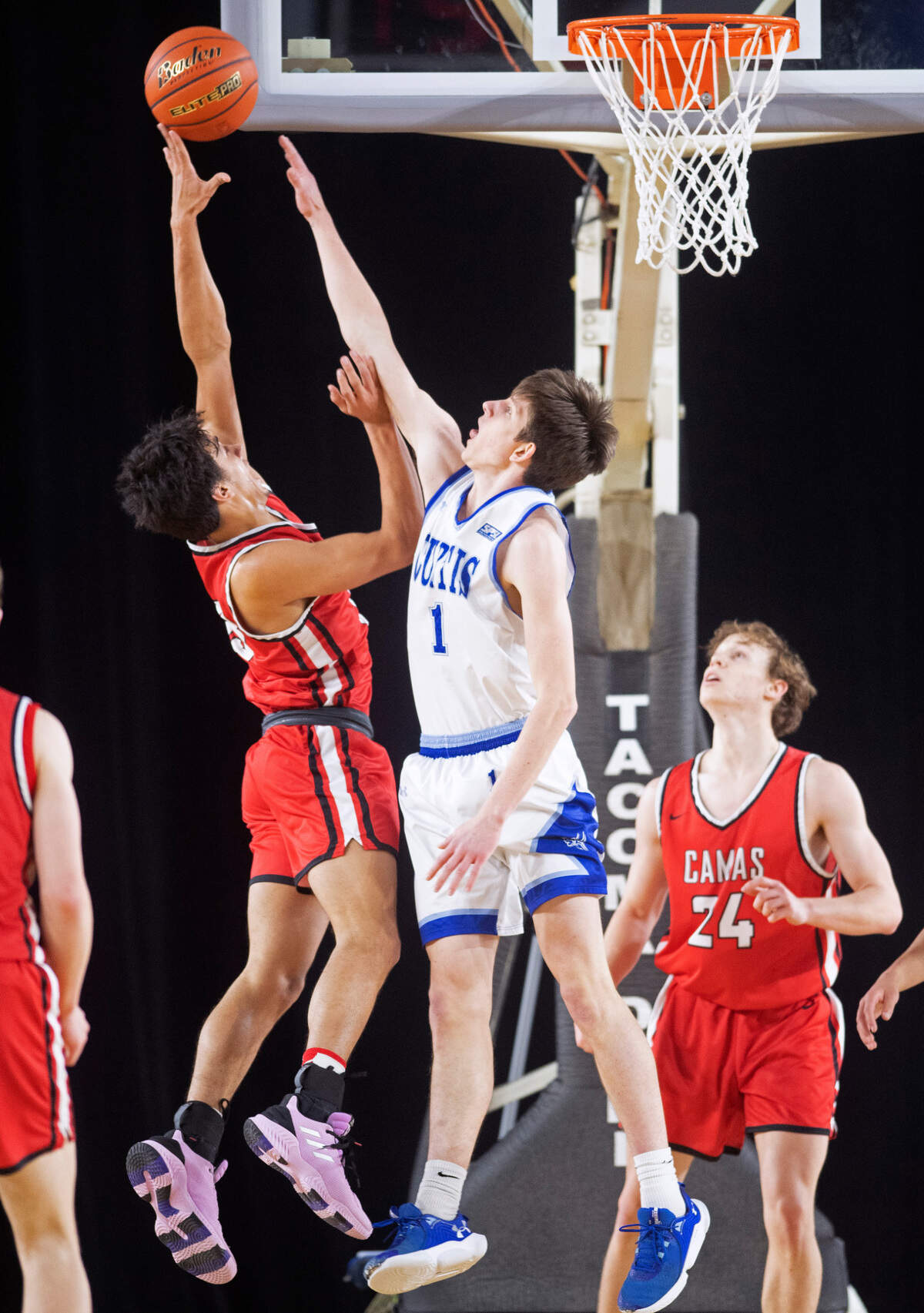 Camas’ Theo McMillan is pressured by Curtis defender Tyce Paulsen during their state quarterfinal game at the WIAA state basketball tournament in the Tacoma Dome in Tacoma, Washington, on Wednesday, March 1, 2023. Curtis won the game, 73-46