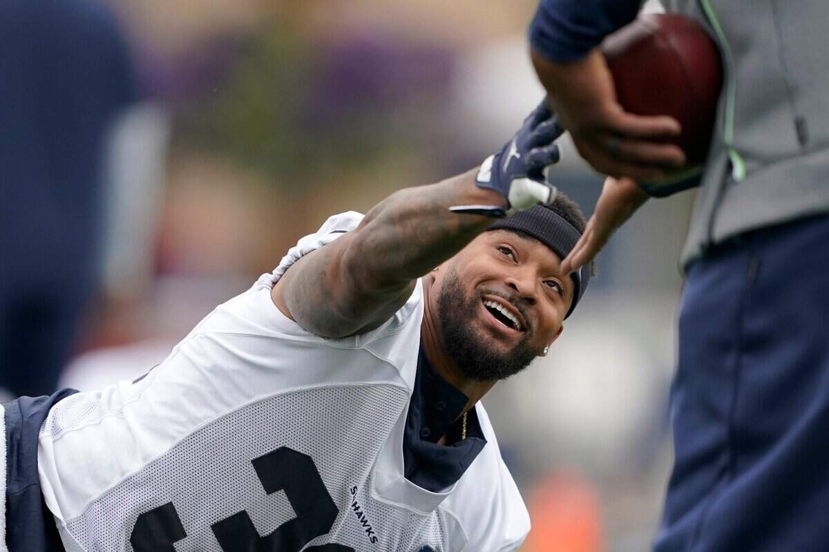 Seattle Seahawks safety Jamal Adams stretches before an NFL football practice, Tuesday, Aug. 17, 2021, in Renton, Wash. The Seahawks signed Adams to a four-year contract extension Tuesday that is expected to make the former All-Pro the highest-paid safety in the NFL. (AP Photo/Ted S. Warren)