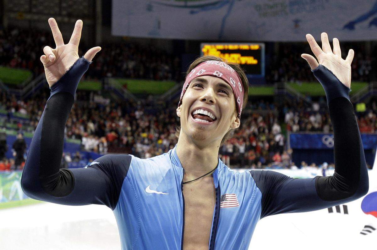USA’s Apolo Anton Ohno holds up eight fingers, representing the number of medals he has won, after the U.S. won the bronze medal for the men’s 5000m relay short track skating competition at the Vancouver 2010 Olympics in Vancouver, British Columbia, Friday, Feb. 26, 2010. (AP Photo/Amy Sancetta)