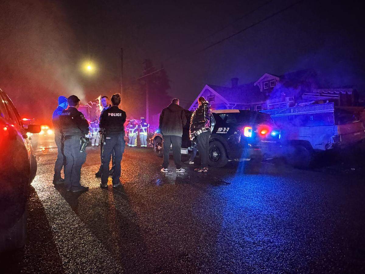 At least three people were taken to hospitals after a possible stabbing and house fire in Tacoma on Tuesday.