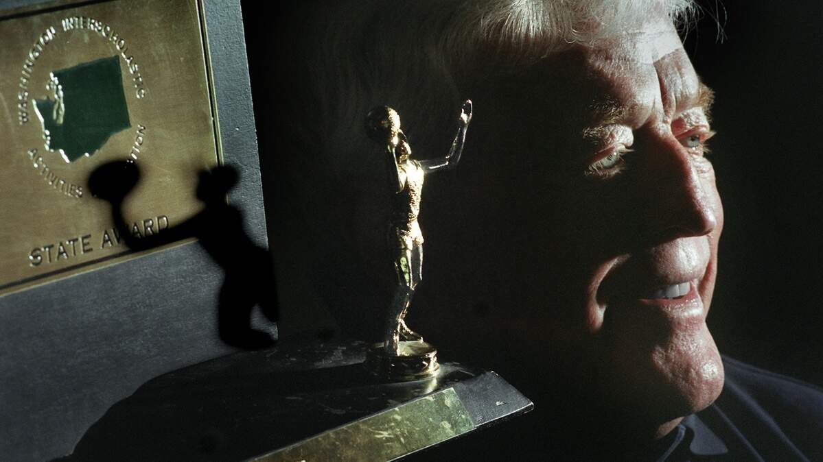 Former Lincoln High School basketball coach Ron Billings Sr. is shown with the 1975 AAA boys state-championship trophy from the 1975 on Thursday, May 24, 2001.