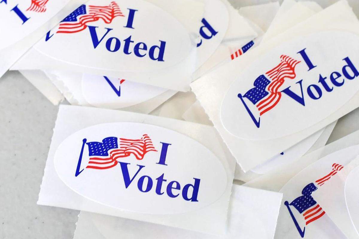 "I voted" stickers have become an election day badge of honor; some merchants even offer special deals to voters.