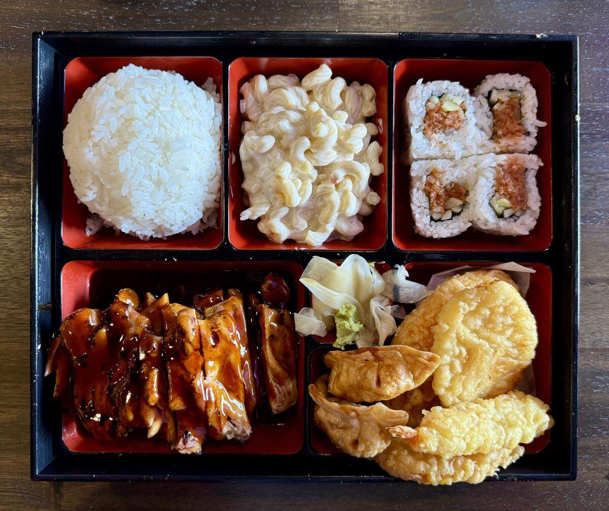 The signature bento boxes are a great value, with a mound of protein (here the flagship chicken teriyaki), several pieces of tempura and gyoza, four sushi roll pieces, rice and a side (shown with mac salad).