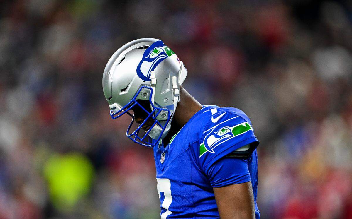 Seattle Seahawks quarterback Geno Smith (7) walks off the field after failing to convert during the third quarter of the game against the San Francisco 49ers at Lumen Field, on Thursday, Oct. 10, 2024, in Seattle, Wash.