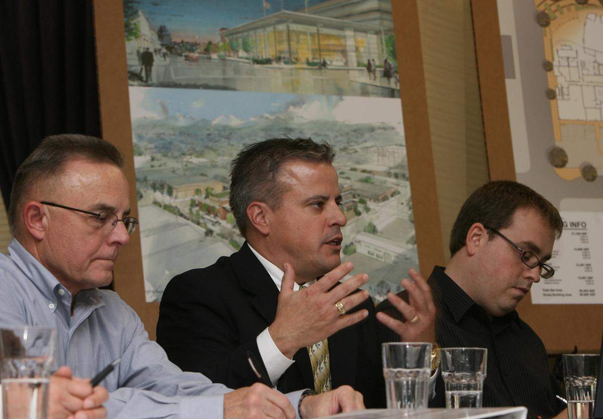 Lyn Messenger (from left), Brett Santhuff, and Scott Harm of Belay Architecture answer questions during their building proposal for the new Olympia City Hall, Oct. 21, 2008 at the Phoenix Inn.