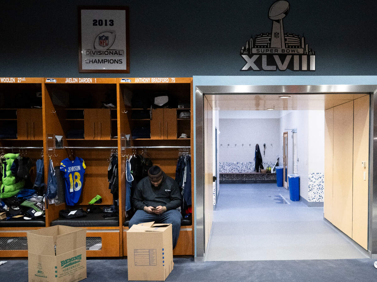 Seattle Seahawks guard Anthony Bradford (75) clears out his locker at the Virginia Mason Athletic Center, on Monday, Jan. 6, 2025, in Renton, Wash.