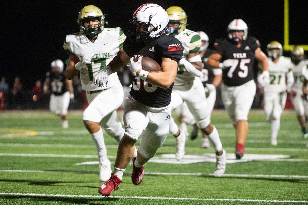 Yelm running back William Carreto breaks away from Timberline’s secondary for a large rushing gain during the first quarter of a 3A SSC game on Thursday, Oct. 13, 2022, at Yelm High School in Yelm, Wash.