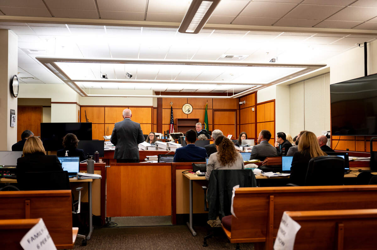 Defense attorney Brett Purtzer cross-examines Dr. Roger Mitchell during the trial of three Tacoma Police officers in the killing of Manny Ellis at Pierce County Superior Court, Monday, Oct. 16, 2023, in Tacoma, Wash. Tacoma Police Officers Christopher Burbank, Matthew Collins and Timothy Rankine stand trial for charges related to the March 2020 killing of Manny Ellis. (Brian Hayes / Pool Photo – The News Tribune)