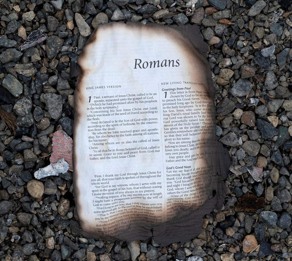 A burned Bible page at the Jamestown Estates mobile home park in Lakewood, Washington, on Wednesday, Aug. 9, 2023.
