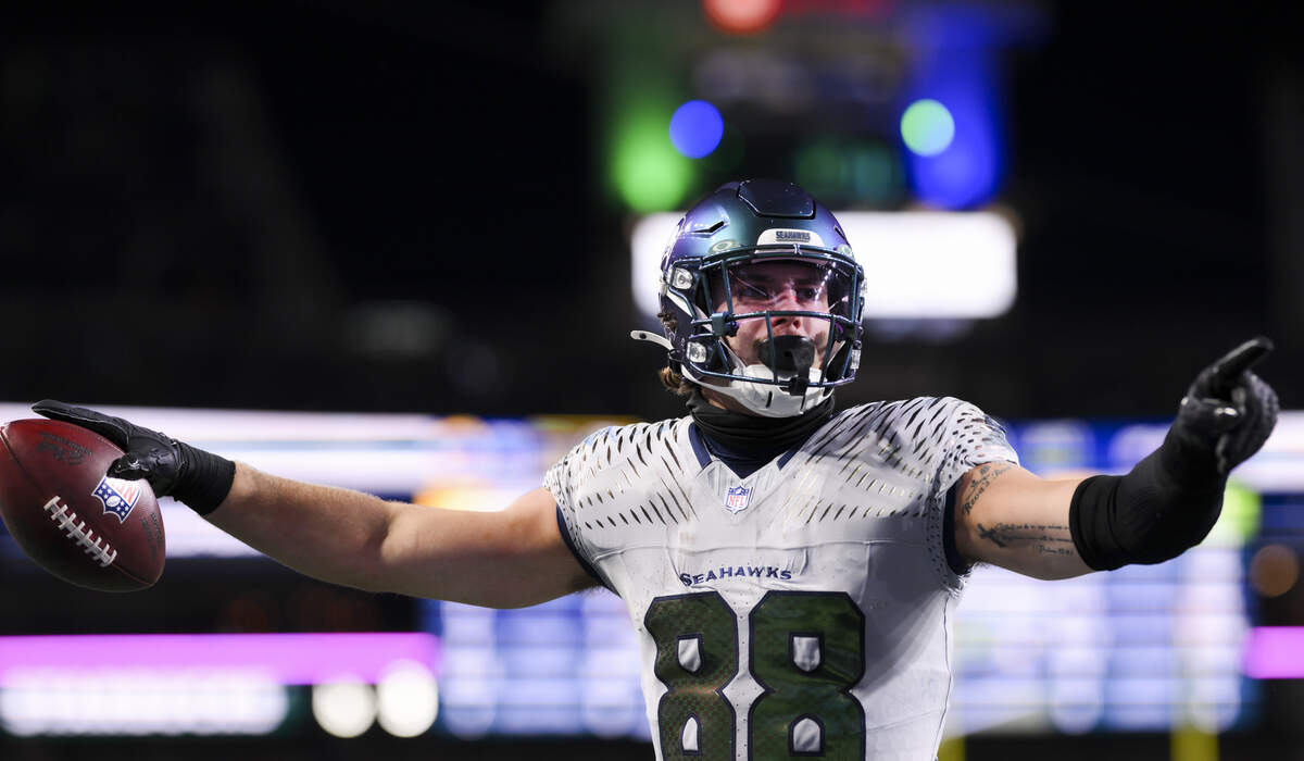 Seattle Seahawks tight end AJ Barner (88) reacts to a touchdown against the Los Angeles Rams during the third quarter of the game at Lumen Field, on Thursday, Dec. 18, 2025, in Seattle.