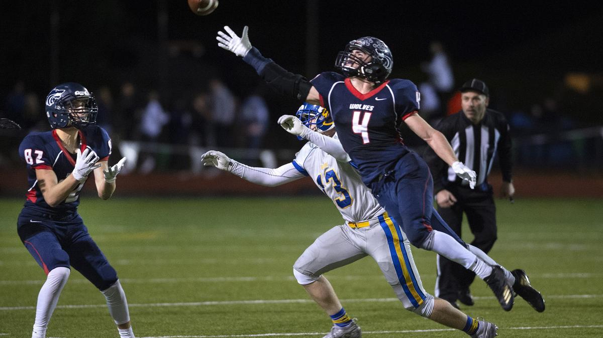 Black Hills wide receiver Ethan Loveless (4) lays out for a pass in front of Fife defensive back Kacey Koehn during Friday night’s 2A football state quarterfinal game at Tumwater District Stadium on Nov. 16, 2018. Fellow wide receiver Nic Bovencamp (82) came away with the reception.