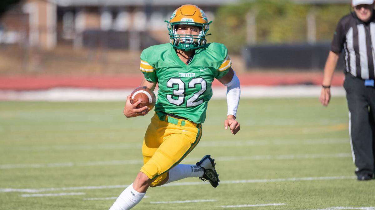 Peyton Davis turns upfield during the first half of Tumwater’s 54-0 win over Kelso on Sept. 15.