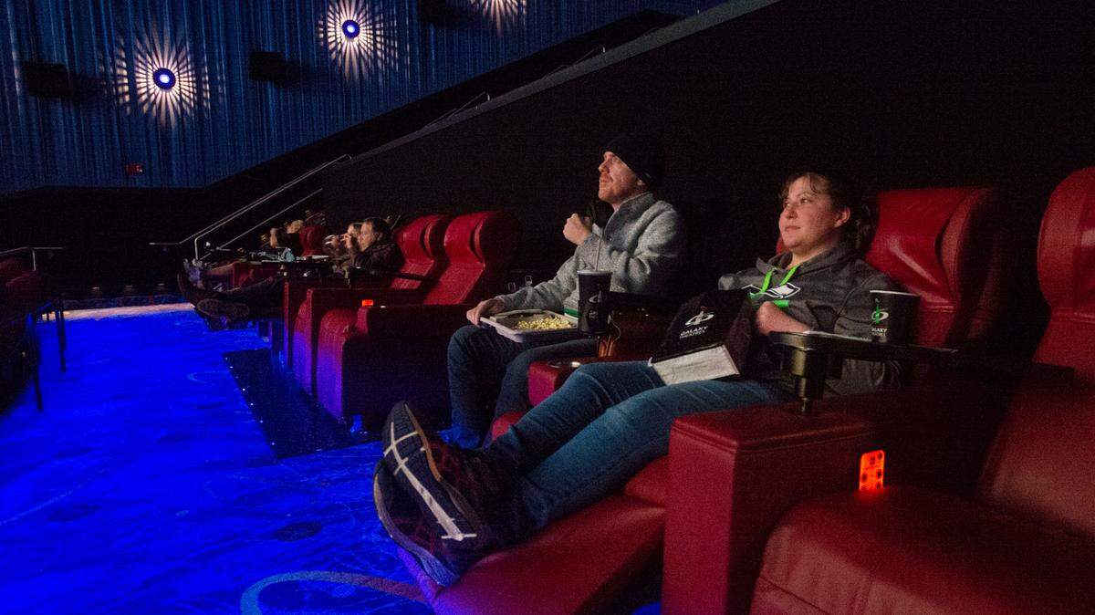 The re-opening of Gig Harbor’s Galaxy Theatres Friday, Feb. 6, 2021 was welcomed by Samantha Buchanan and Dean Kelly who watch an early evening showing of the Tom Hanks western “News of the World.” The couple said they were excited to “get back to some sort of normalcy.” According to current COVID-19 safety guidelines, movie-goers are allowed to remove their masks while eating and drinking.