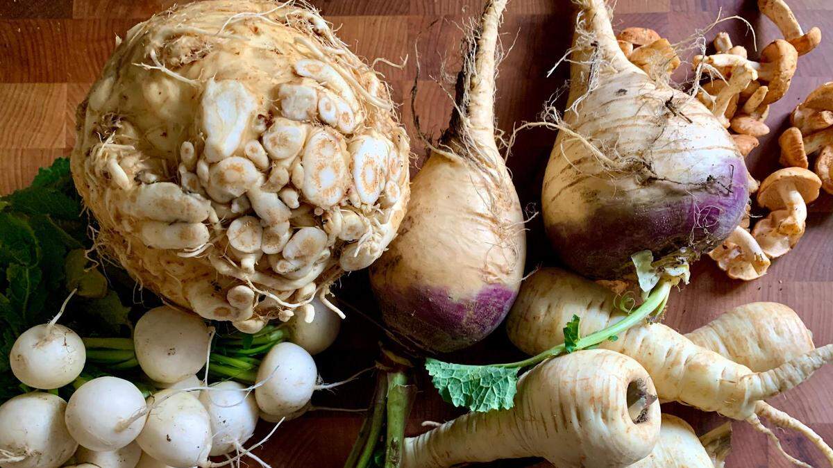 Keep your Thanksgiving local by stocking up on seasonal veggies like celeriac, turnips and sharp white radishes at local farmers markets.