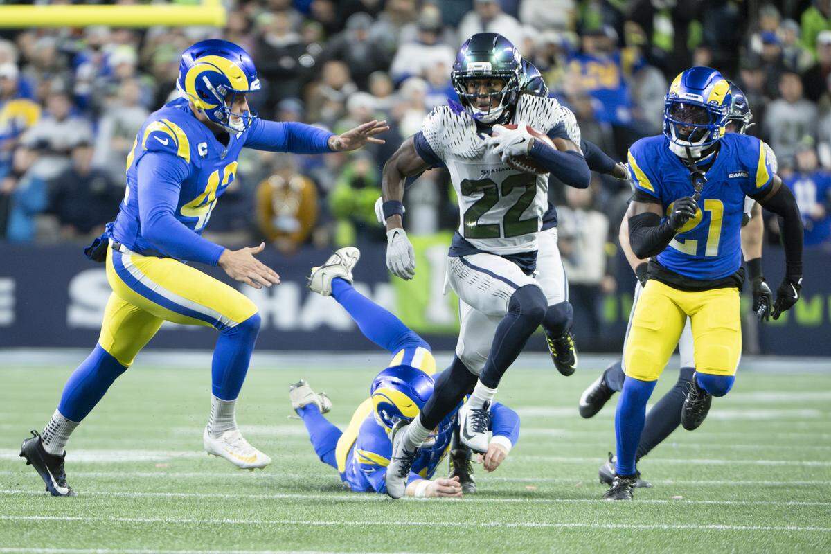 Seattle Seahawks wide receiver Rashid Shaheed (22) dodges Los Angeles Rams defenders in the second half of the game at Lumen Field, on Thursday, Dec. 18, 2025, in Seattle. Shaheed carried the ball to the end zone for a touchdown.