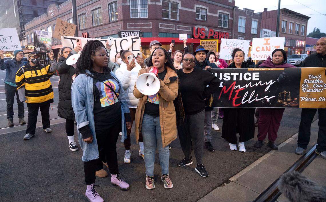 Protesters gather at the intersection of Martin Luther King Way and 11th Street in the Hilltop neighborhood of Tacoma, Wash., to hold an impromptu press conference as tensions rise after three Tacoma Police officers were found not guilty in the death of Manuel Ellis on Thursday, Dec. 21, 2023.
