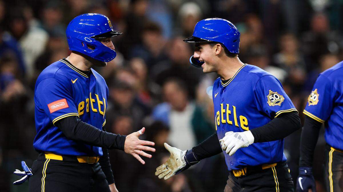 SEATTLE, WASHINGTON - MARCH 27: Cole Young #2 of the Seattle Mariners celebrates after his three-run home run during the fourth inning against the Cleveland Guardians at T-Mobile Park on March 27, 2026 in Seattle, Washington. (Photo by Maddy Grassy/Getty Images)