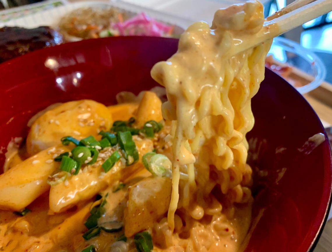 In addition to the signature protein-plus-rice, japchae and salad boxes, the menu at Kimchi Box in Tacoma includes ddukkbokki, here in the “rose” sauce with ramen noodles.