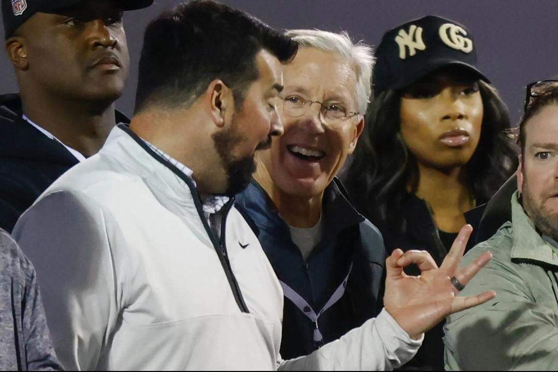 Seahawks head coach Pete Carroll, middle, talks with Ohio State coach Ryan Day as Buckeyes players run a drill at OSU’s Pro Day for NFL scouts in Columbus, Ohio, March 22, 2023. Seahawks general manager John Schneider is at the far right, cropped in this photo.