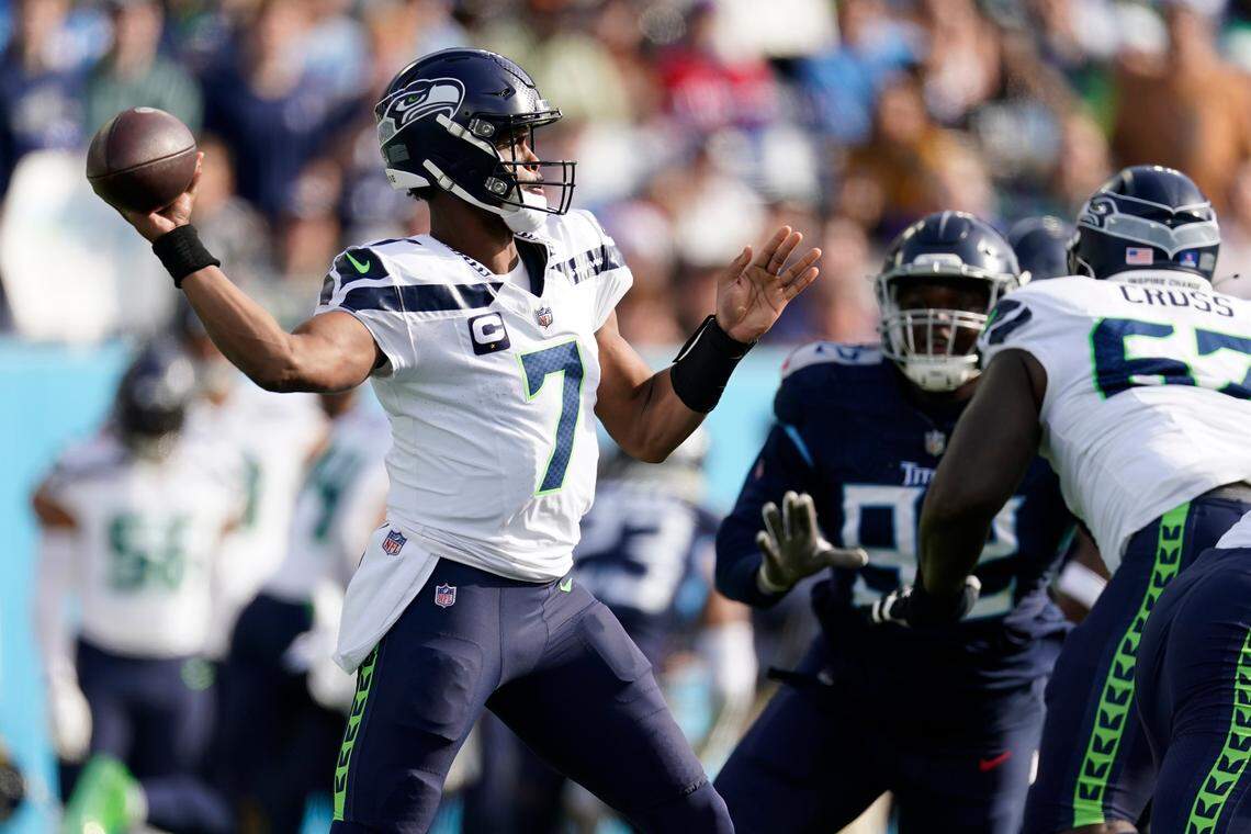 Seattle Seahawks quarterback Geno Smith (7) passes against the Tennessee Titans during the first half of an NFL football game on Sunday, Dec. 24, 2023, in Nashville, Tenn. (AP Photo/George Walker IV)