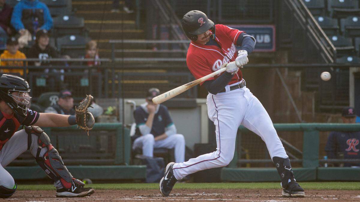 Tacoma Rainiers first baseman Zach Green swings at a pitch during a Triple-A baseball game against the Reno Aces on Sunday, May 15, 2022 at Cheney Stadium in Tacoma, Wash.