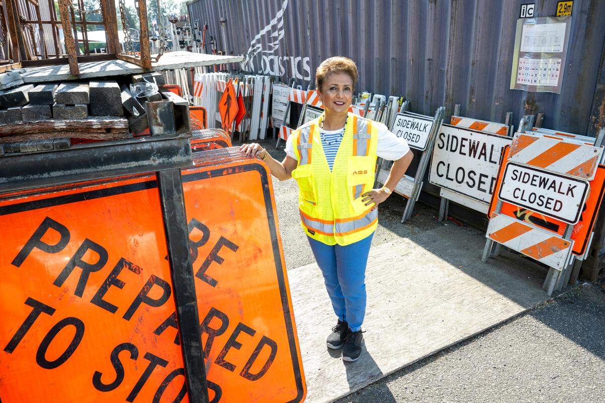 Arti O’Brien, the president of Advanced Government Services, stands for a portrait with equipment from the safety equipment supplier on Tuesday, June 24, 2025, in Tacoma, Wash. O’Brien credits the business’s success to the support she received from the Minority Business Development Agency.