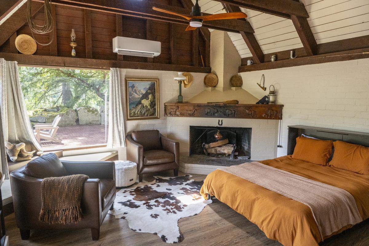 A restored cabin belonging to the original landowners of what is now Northwest Trek Wildlife Park in Eatonville, Wash. is available for guests to rent beginning May 15, 2026. Visitors can see original engravings of bison, elk and bighorn sheep David “Doc” Hellyer carved above the mantle.
