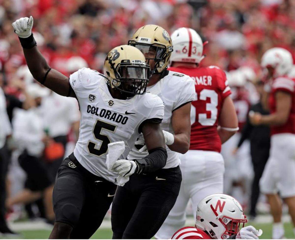 Colorado’s Davion Taylor (5) celebrates after sacking Nebraska quarterback Adrian Martinez during a game in Lincoln in 2018.