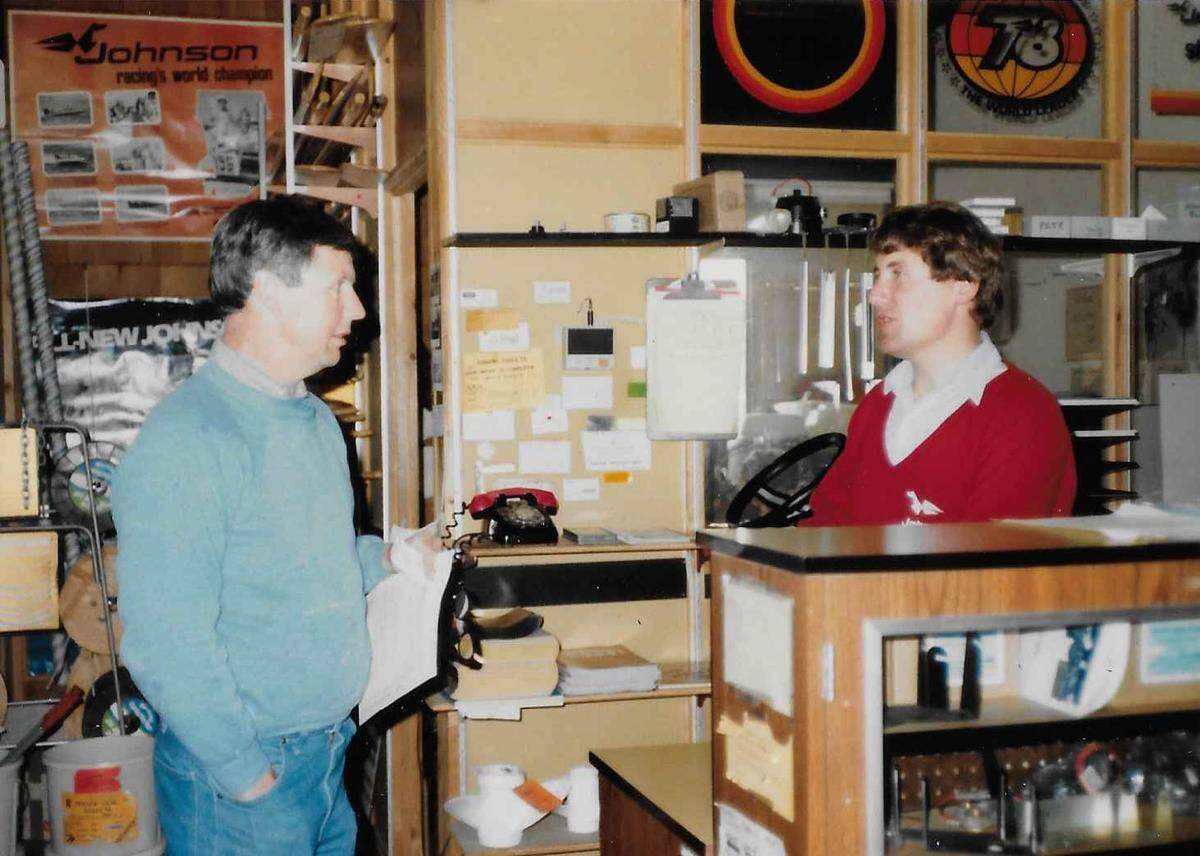 Allan and Jeff Bucholz work the TideRunner sales counter inside the boat company showroom that formerly occupied the building at 8809 N. Harborview Dr. in Gig Harbor, Wash. The building now houses businesses including Devoted Kiss Café.