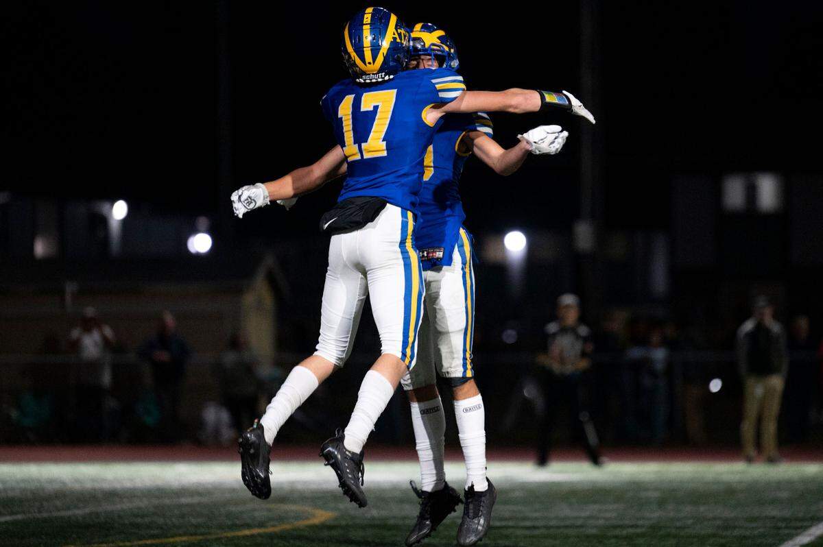 Fife defensive back Tylor Kern celebrates with Beau Faulaau after intercepting a pass by Enumclaw quarterback Gunnar Trachte intended for Austin Paulson during the second quarter of 2A SPSL game on Thursday, Sept. 22, 2022, at Fife High School in Fife, Wash.