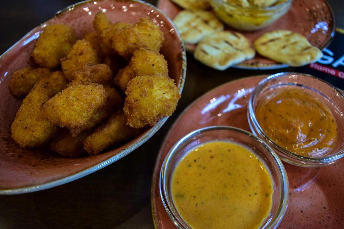 Galos focuses on grilled piri-piri chicken, but sides and shareables, like these cauliflower bites with piri dips, make for a full meal.
