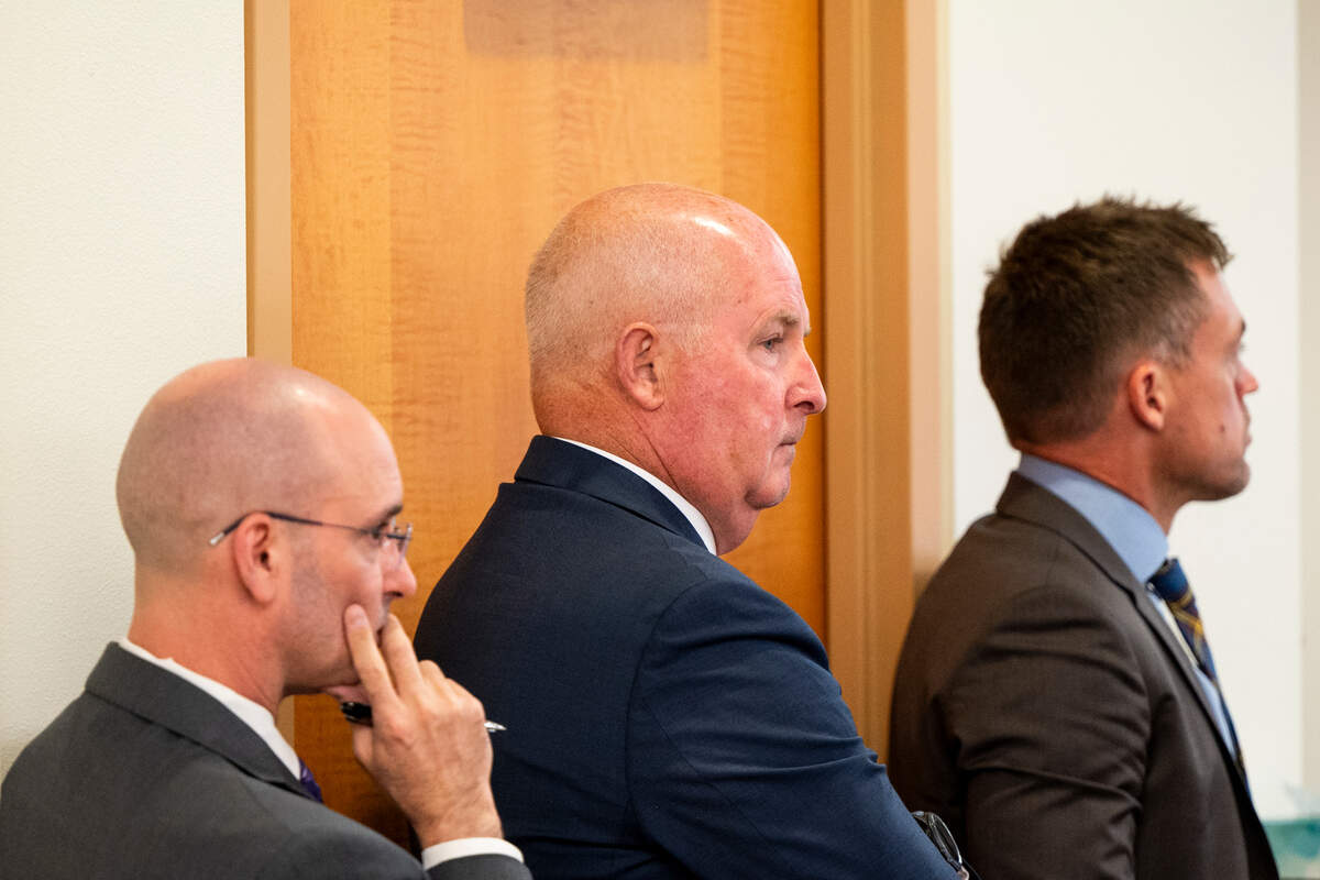 Defense attorneys Jared Ausserer, Brett Purtzer and Casey Arbenz watch Tuesday as witness Keyon Lowery draws out the intersection where Manuel Ellis died.