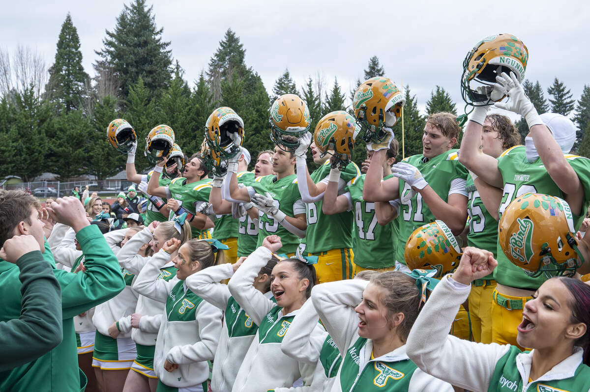 Tumwater fans, cheerleaders and players cheer along to a school fight song after their win over Franklin Pierce on Saturday, Nov. 22, 2025, in Tumwater, Wash.