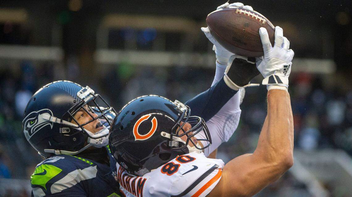 Seattle Seahawks cornerback John Reid (29) defends as Chicago Bears tight end Jimmy Graham (80) catches a touchdown pass from quarterback Nick Foles (9) during the fourth quarter of an NFL game on Sunday afternoon at Lumen Field in Seattle.