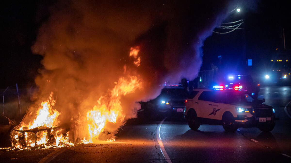 A vehicle reported stolen from Bellevue was found on fire on the side of Pacific Highway in Milton early Wednesday morning. Fife police suspect people in the vehicle shot at and rammed a Honda off the road on Wapato Way, then drove to Milton and intentionally set their vehicle on fire.