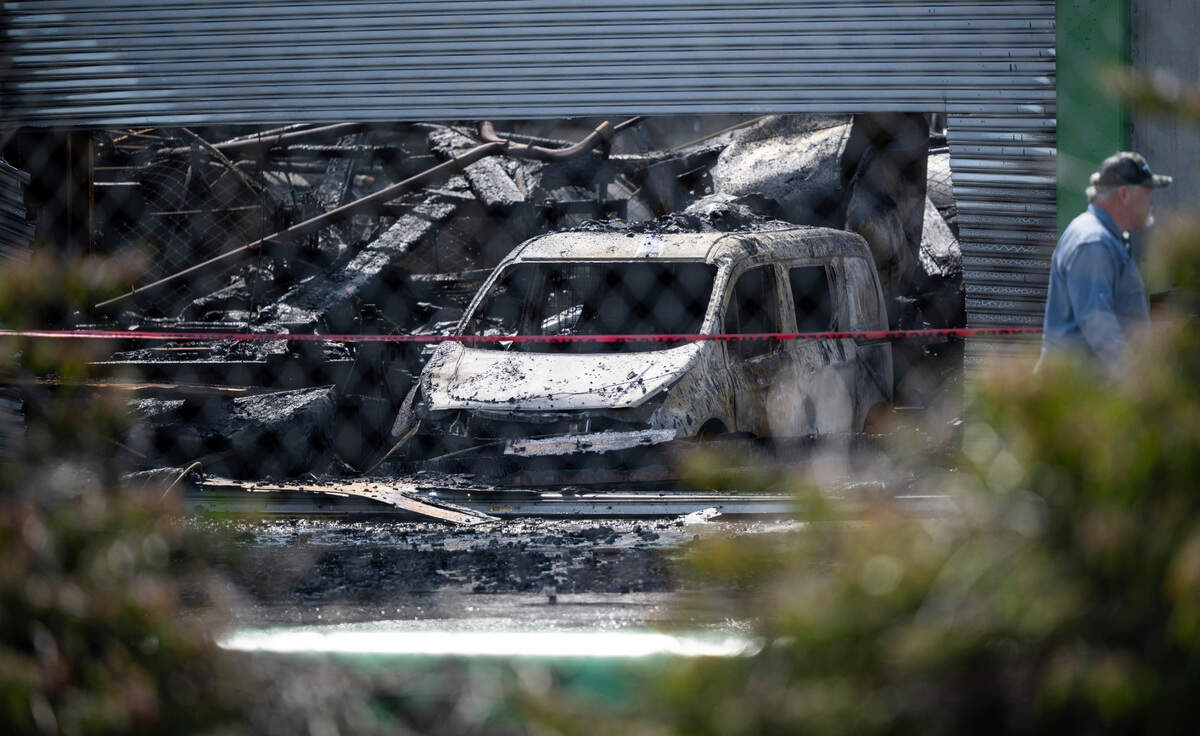 The remnants of an Omega Morgan warehouse can be seen after firefighters responded to a 2-alarm fire around 3:41 a.m. at the building on 46th Avenue East on Saturday, April 23, 2022 in Fife, Washington.