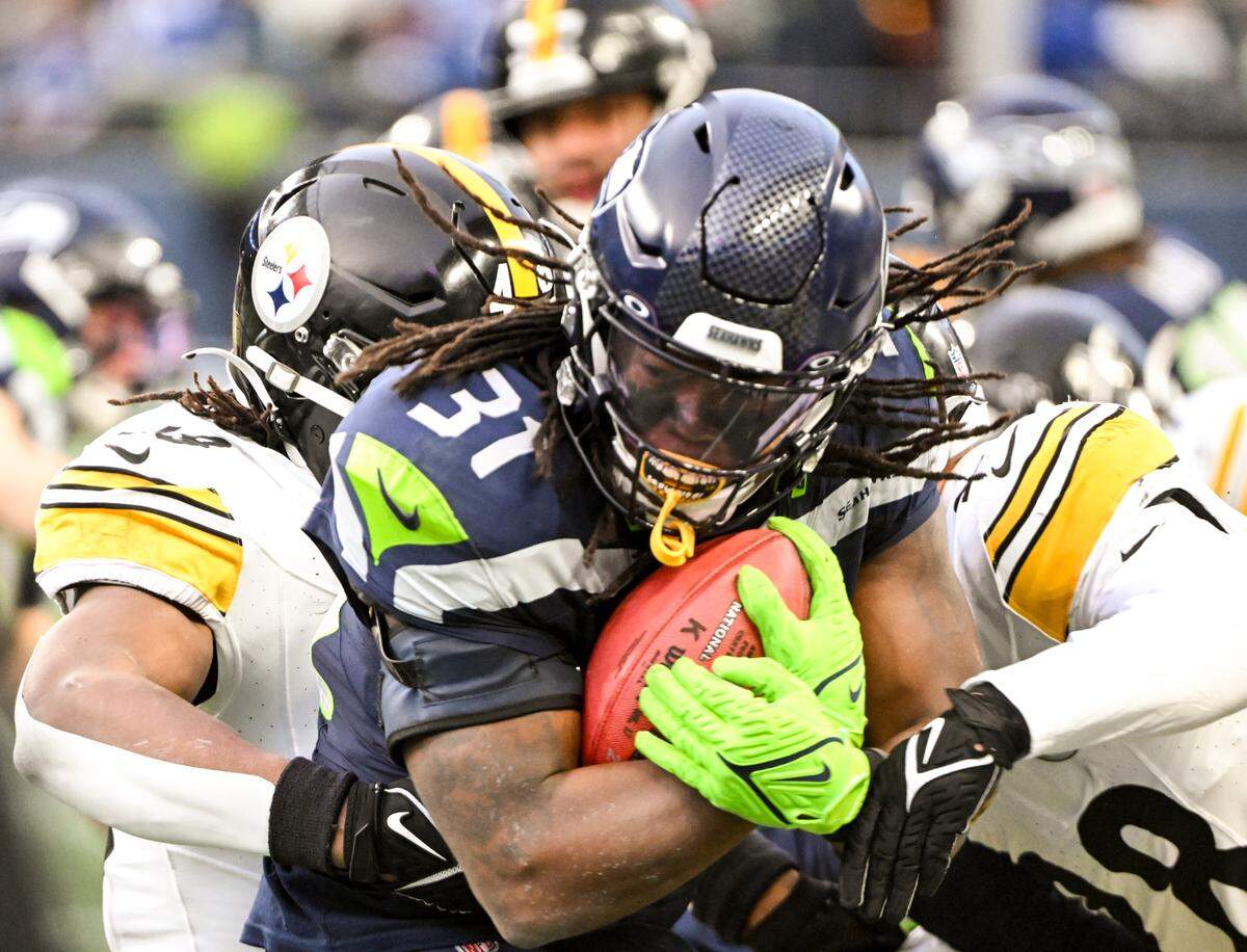 Seattle Seahawks running back DeeJay Dallas (31) is wrapped uo by Pittsburgh Steelers special teams on a kick return during the fourth quarter of the game at Lumen Field, on Sunday, Dec. 31, 2023, in Seattle, Wash.