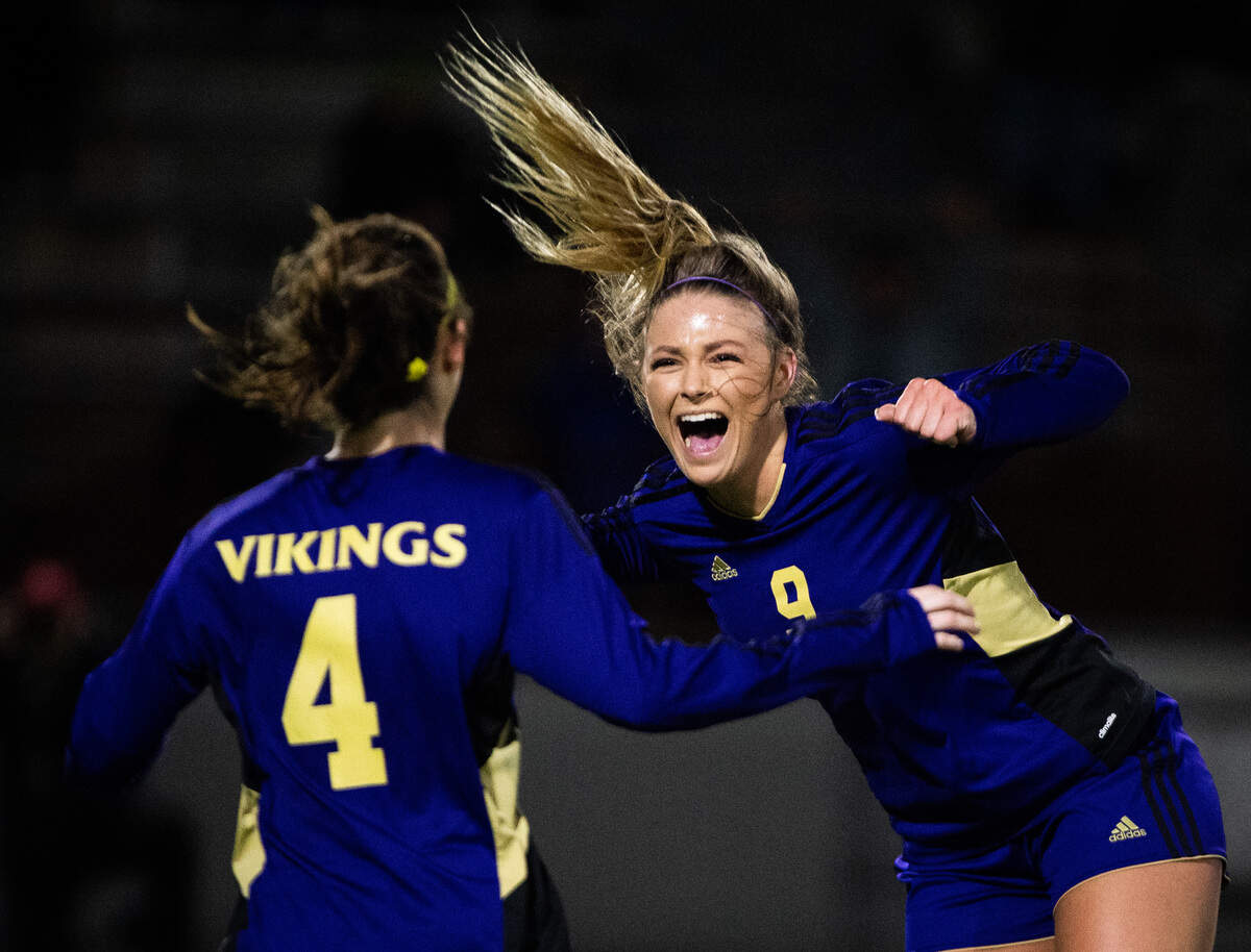 Puyallup’s Sydney Evans (9) and Kaelee Huetten celebrate after Evans’ game-winning goal in stoppage time. Puyallup played Auburn Riverside in the WIAA 4A Girls Soccer State Championship game at Sparks Stadium in Puyallup, Wash., on Saturday, Nov. 23, 2019.